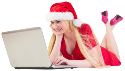 Festive blonde using a laptop