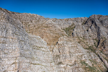 colorful rock layers of cliffs at Waaihoek peak  aerial, South Africa