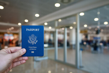 Man hodling passport of United States of America.