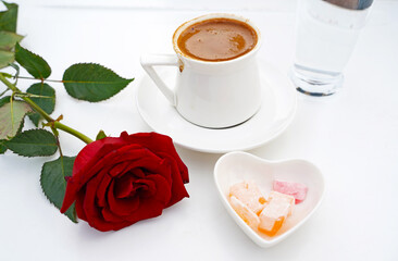 Türk kahvesi - Turkish coffee in a cup with Turkish delight and rose composition     