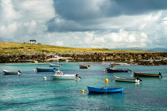 Boats float near the shoreline of the island of Iona, Scotland; Iona, Scotland