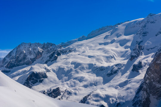 View from Belvedere ski area peak towards Marmolada mountain, Fassa Valley, The Dolomites in Northern Italy; Trentino-Alto Adige, Trentino, Italy