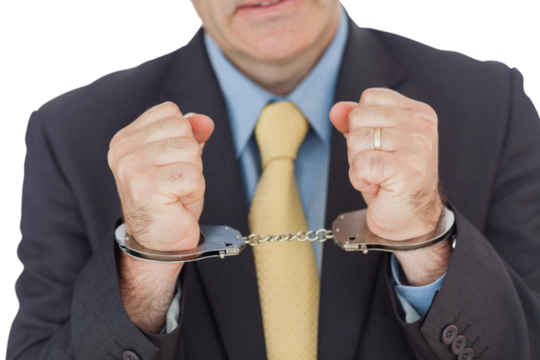 Closeup of businessman with handcuffed hands