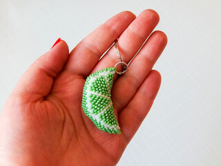 Fruit keychain in a female hand