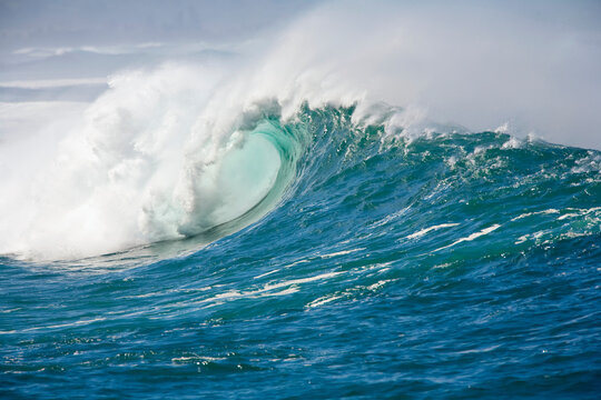 Large winter surf with waves breaking on the north shore of Oahu at Waimea on a big day; Oahu, Hawaii, United States of America