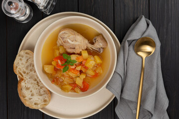 Roast chicken legs with vegetables with broth