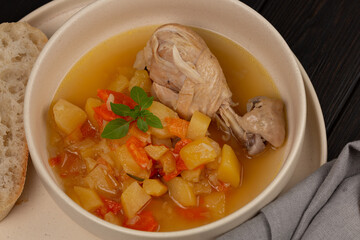 Roast chicken legs with vegetables with broth