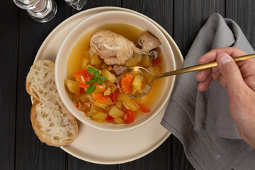 Roast chicken legs with vegetables with broth