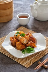 crispy shrimp dumpling in white plate
