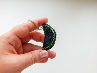 Hand holding a colorful keychain