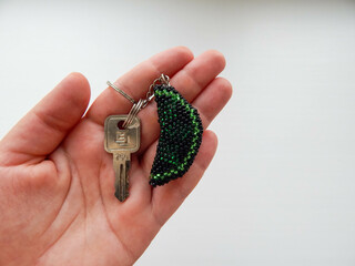 Bright key chain in a female hand