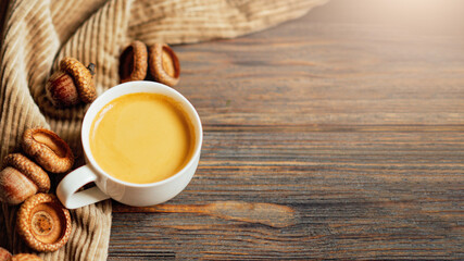 cup of acorn coffee. Space for text. Cozy Autumn image. Acorn autumn brown background. Selective focus. Macro view. Food trend. coffee substitute