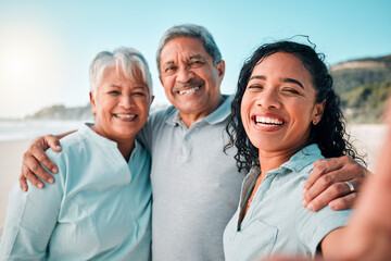 Senior parents, daughter and beach selfie with smile, hug and happiness in summer sunshine for social media. Women, man and portrait with happy, excited face and profile picture with love on holiday