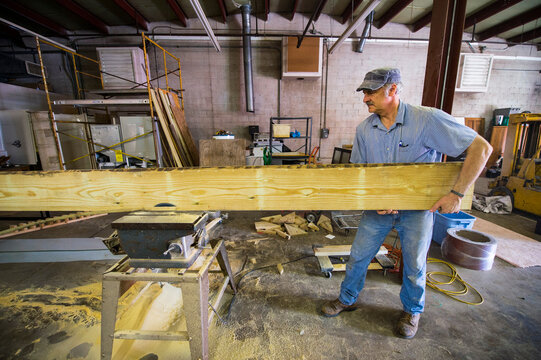 Man works in his woodshop; Cortland, Nebraska, United States of America