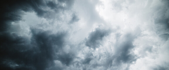 Dramatic cloudscape texture. Dark heavy thunderstorm clouds before rain. Overcast rainy bad weather. Storm warning. Natural gray background of cumulonimbus. Nature backdrop of stormy cloudy sky.