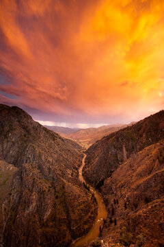 Dramatic glowing thundercloud passes over the Middle Fork of the Salmon River in Idaho, USA; Idaho, United States of America