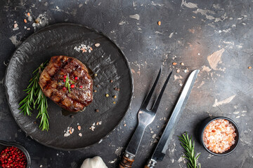 steak roasted on the grill on a dark background. Healthy food concept. place for text, top view