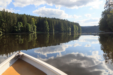 Rowing boat and reservoir Höllensteinsee panorama near Viechtach in Bavarian Forest, Germany