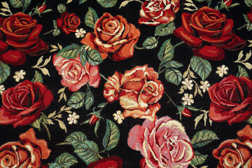 tapestry fabric with a pattern of roses. vintage flowers on black fabric background.