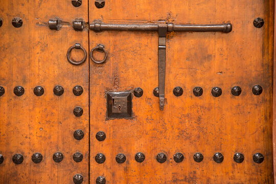 Close-up detail of a metal studded door and lock; Marrakech, Morocco