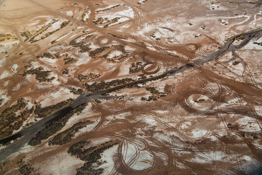 Car tire tracks on a salt pan; Wyndham, Western Australia, Australia