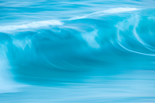 Crest of a bright blue wave off the shores of Kangaroo Island; Adelaide, South Australia, Australia