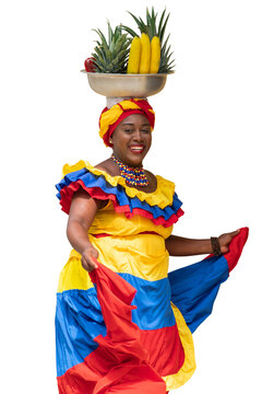 Happy smiling Palenquera fresh fruit street vendor typical of Cartagena, Colombia, dancing, isolated in transparent PNG. Afro-Colombian woman in traditional clothing, Colombian culture and lifestyle. 