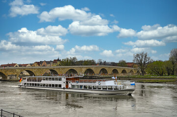 a tourist boat sails on the Danube Regensburg Germany