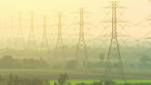 A high voltage pole can appear as a tall and slender structure, towering above the surrounding landscape. The pole typically has a metal frame with insulators and cables running along its length
