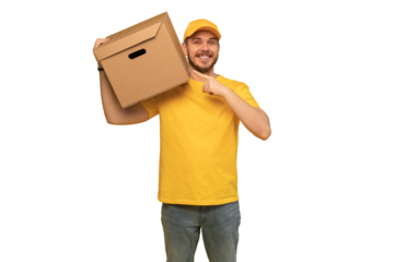 Portrait of excited delivery man in yellow uniform holding paper box isolated over transparent background