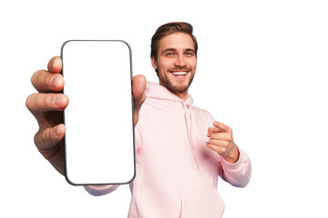 Mobile App Advertisement. Handsome Excited Man Showing Pointing At Empty Smartphone Screen Posing Over Transparent Background, Smiling To Camera. Check This Out, Cellphone Display Mock Up - 592005282