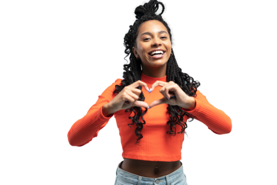 Young lovable woman with african hairstyle showing heart and laughing during indoor photoshoot. Graceful cute girl in casual clothes enjoying leisure time on transparent background