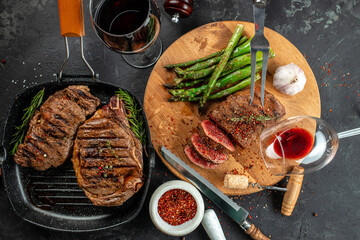 Barbecue steak with green asparagus and red wine. Healthy dinner or lunch