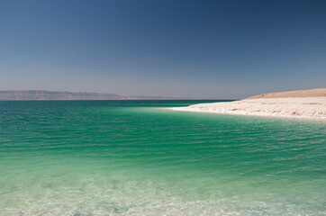 Dead Sea on a sunny day with halite formations, Jordan