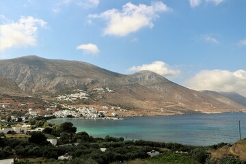 view of Aegiali village with the surrounding mountains and the bay on the island of Amorgos, Greece 