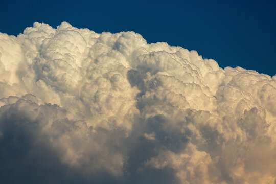 Close-up of dramatic storm clouds and blue sky above; Calgary, Alberta, Canada