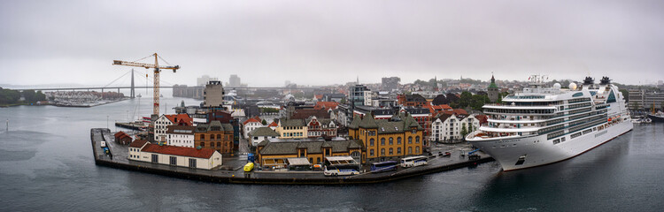 Obraz premium Panoramic views of Stavanger harbor, Rogaland, Norway. Cruise ship Seabourn Ovation harbored in port of Stavanger.