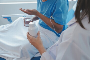 Women Asian doctors hold the patient hand and encourage and provide medical advice While checking the patient health in bed. Concept of Care and compassion, antenatal care, Threatened abortion