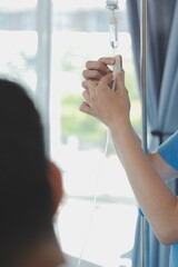 Women Asian doctors hold the patient hand and encourage and provide medical advice While checking...