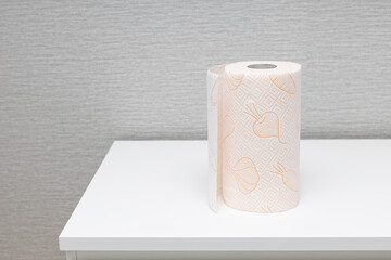 paper towel roll on the edge of the table.