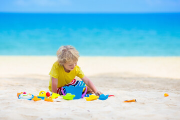 Kids playing on beach. Children play at sea.