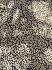 Naklejka premium White paving stones on the roads of Portugal, top view