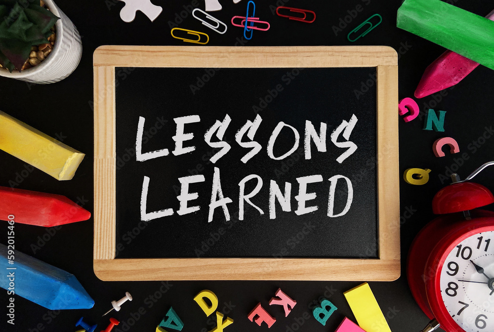 Poster wooden board with lessons learned text on a background of various colorful subjects