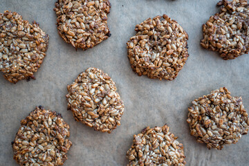 Vegan cookies made of banana and different seeds, photographed with natural light