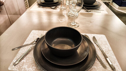 Empty plates and mugs on the table. Beautiful table setting. Top view and background