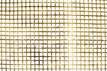 Texture of a plastic grid of yellow color on a white background. Mosquito net background