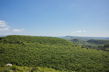 Fototapeta premium blue sky beautiful nature green forest mountains hiking journey