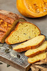 pumpkin bread sliced on wooden board, organic healthy products. Detox and clean diet concept