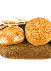 Bread, baguettes and sweet pastries on a white . Vertical photo.