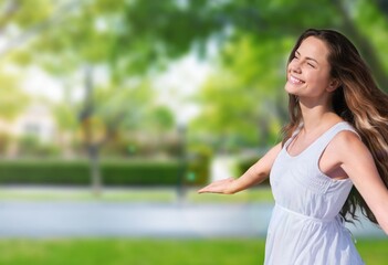 Young happy woman in green forest. .
